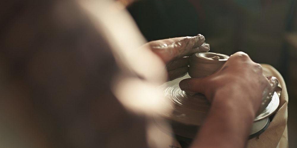 Picture of male hands forming clay
